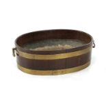 A GEORGE III OVAL BRASS BOUND MAHOGANY WINE COOLER
