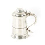 A GEORGE III SILVER TANKARD