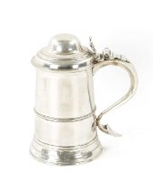 A GEORGE III SILVER TANKARD