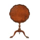 AN 18TH CENTURY COUNTRY MADE MAHOGANY TILT TOP TRIPOD TABLE