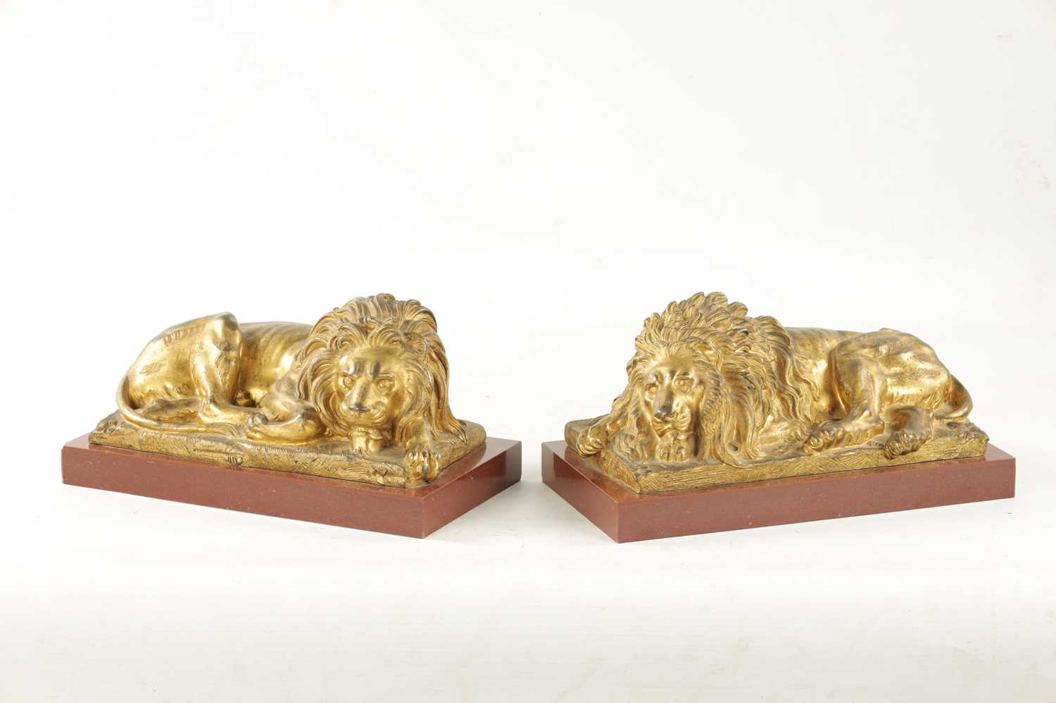 A PAIR OF LATE 19TH CENTURY GILT BRONZE RECUMBENT LIONS - Image 7 of 11