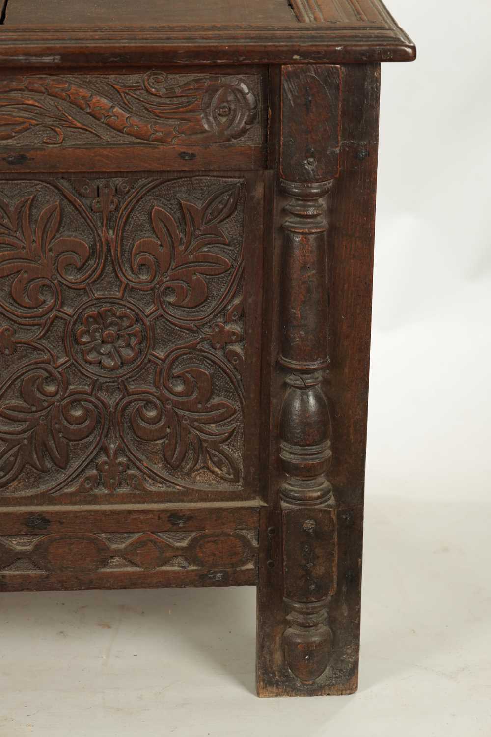 A 17TH CENTURY CARVED OAK THREE PANELLED FRONT COFFER - Image 4 of 8