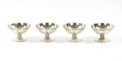 A SET OF FOUR GEORGE III SILVER OPEN SALTS