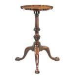 A GEORGE III FIGURED MAHOGANY CANDLE STAND