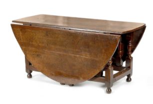 A LARGE 17TH CENTURY JOINED OAK EIGHT SEATER GATE LEG TABLE