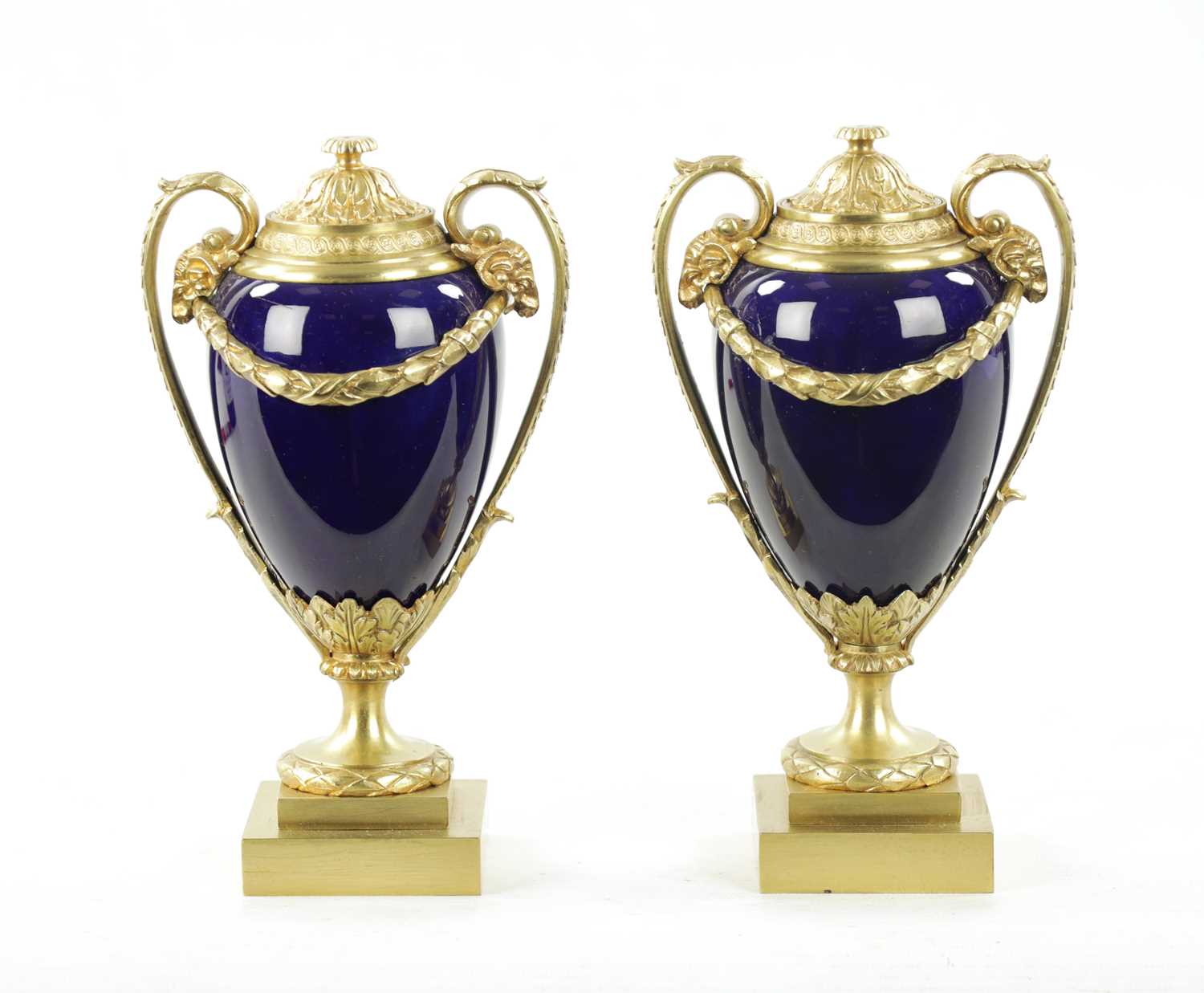 A PAIR OF REGENCY ORMOLU AND PORCELAIN CASSOLETTES IN THE MANNER OF MATTHEW BOLTON