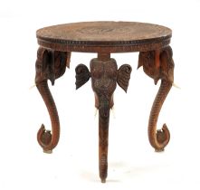 A 19TH CENTURY INDIAN CARVED HARDWOOD OCCASIONAL TABLE