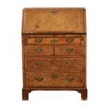 AN EARLY 18TH CENTURY BURR WALNUT BUREAU OF SMALL SIZE