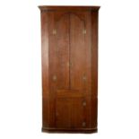 AN EARLY 18TH CENTURY OAK STANDING CORNER CUPBOARD