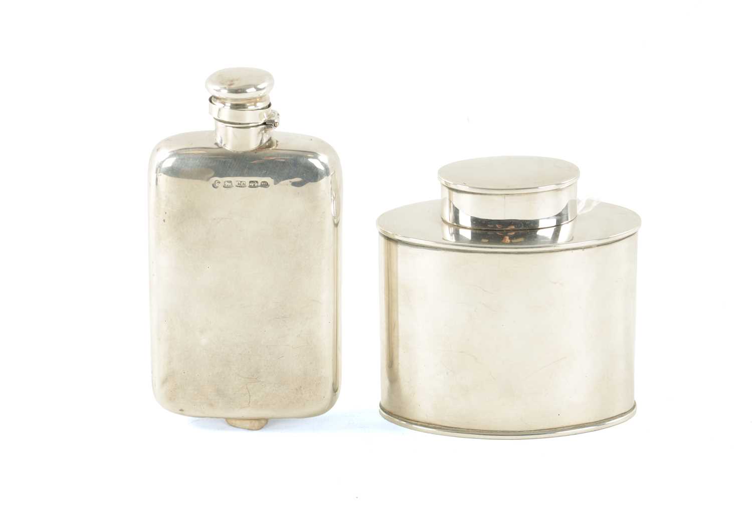 A VICTORIAN SILVER HIPFLASK AND AN EDWARDIAN SILVER TEA CADDY