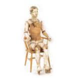 A LATE 19TH CENTURY LIFE-SIZE CARVED HARDWOOD LAY FIGURE