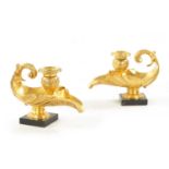 A PAIR OF 19TH CENTURY GILT BRASS REGENCY STYLE CANDLESTICKS