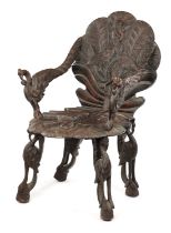 A 19TH CENTURY ANGLO-INDIAN CARVED HARDWOOD ARMCHAIR