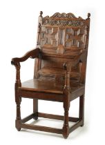 A 17TH CENTURY CARVED OAK JACOBEAN STYLE WAINSCOT CHAIR