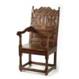 A 17TH CENTURY CARVED OAK JACOBEAN STYLE WAINSCOT CHAIR