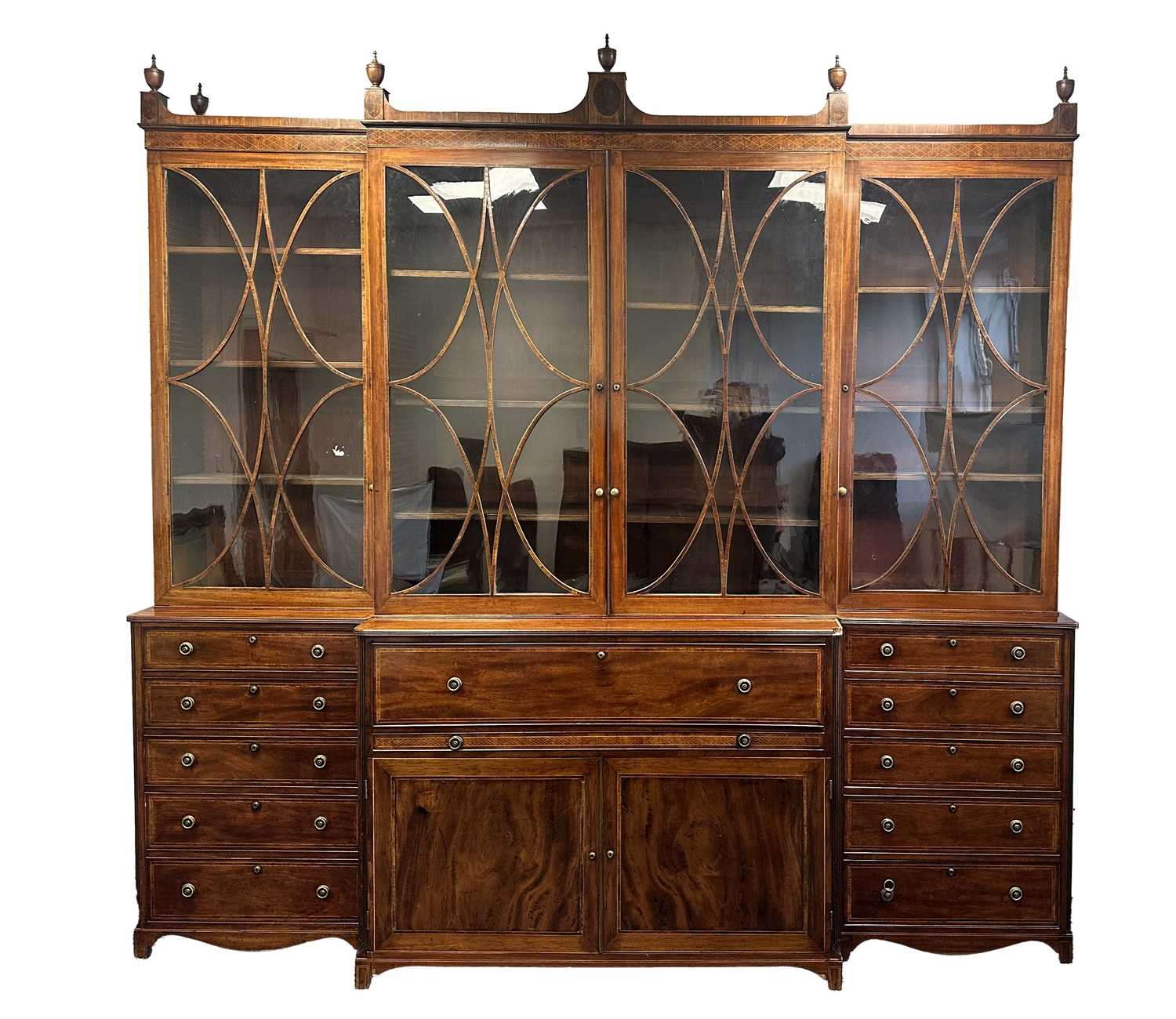 A FINE GEORGE III SHERATON DESIGN INLAID MAHOGANY BREAKFRONT BOOKCASE