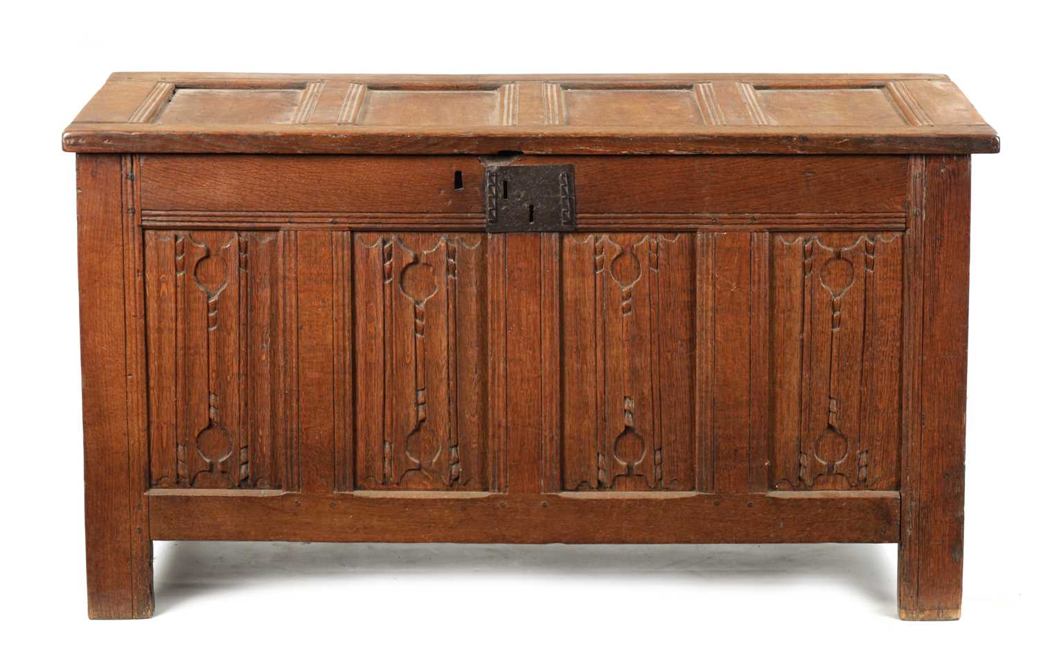 A 17TH CENTURY CARVED OAK LINEN FOLD COFFER