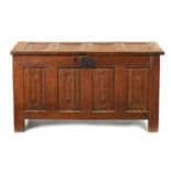 A 17TH CENTURY CARVED OAK LINEN FOLD COFFER