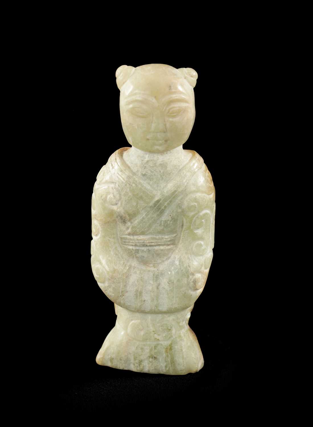 A CHINESE CARVED JADE RELIGIOUS FIGURE