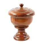 A 19TH CENTURY TREENWARE TURNED WALNUT CUP AND COVER OF LARGE SIZE