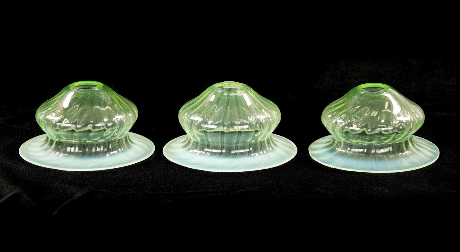 A SET OF THREE 19TH CENTURY VASELINE GLASS SHADES