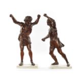 A PAIR OF GRAND TOUR CARVED WALNUT GLADIATORS AFTER THE BORGHESE BRONZE ROMAN FIGURES