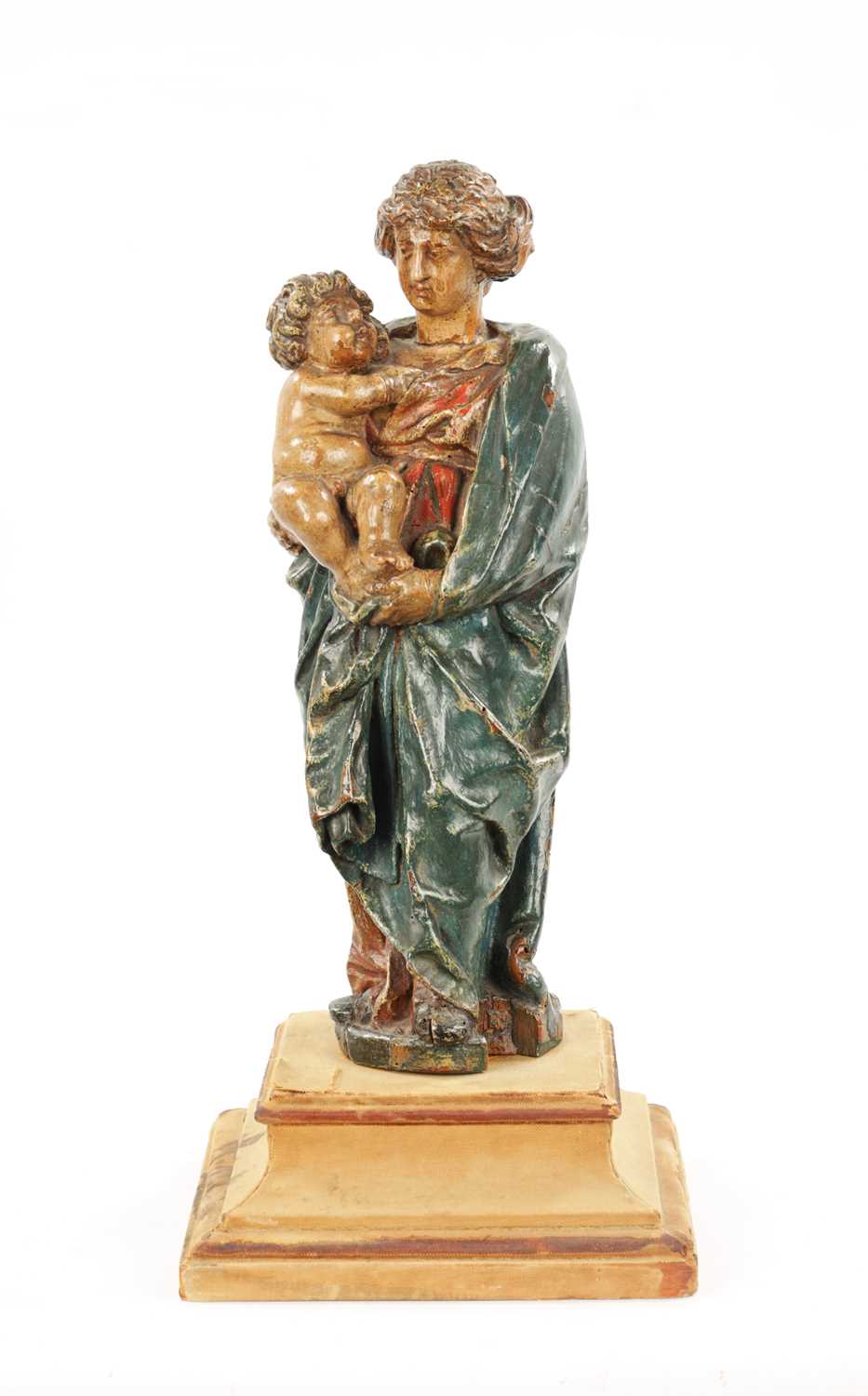 AN EARLY 18TH CENTURY POLYCHROME CARVING OF MADONNA AND CHILD