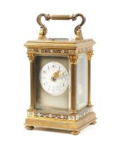 A LATE 19TH CENTURY FRENCH GILT BRASS AND CHAMPLEVE ENAMEL REPEATING CARRIAGE CLOCK