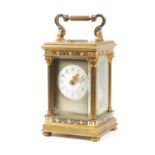 A LATE 19TH CENTURY FRENCH GILT BRASS AND CHAMPLEVE ENAMEL REPEATING CARRIAGE CLOCK