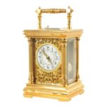 A LATE 19TH CENTURY FRENCH GILT CASED REPEATING CARRIAGE CLOCK