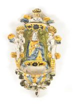 AN EARLY DELFTWARE HANGING HOLY WATER FONT