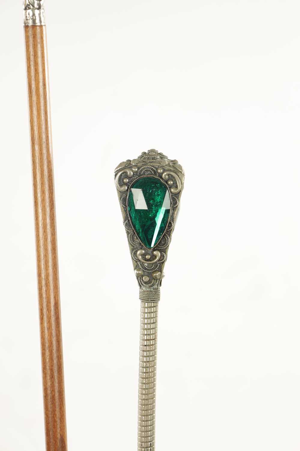 A COLLECTION OF FOUR LATE 19TH CENTURY SILVER AND WHITE METAL TOPPED WALKING STICKS - Image 3 of 6