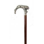 A LATE 19TH CENTURY SILVER TOPPED WALKING STICK MODELLED AS A PROWLING LION