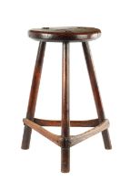 A EARLY ELM AND FRUITWOOD CIRCULAR STOOL