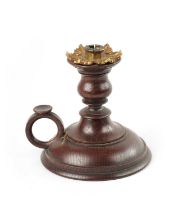 A 19TH CENTURY TURNED OAK CHAMBERSTICK WITH PETAL SHAPED ORMOLU SCONCE