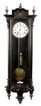 A LATE 19TH CENTURY EBONISED SINGLE WEIGHT VIENNA STYLE WALL CLOCK