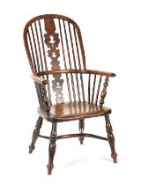 AN EARLY 19TH CENTURY NOTTINGHAMSHIRE YEW-WOOD HIGH BACK WINDSOR CHAIR