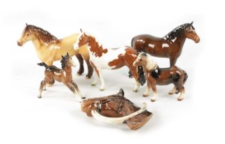 OF EQUESTRIAN INTEREST A COLLECTION OF CERAMIC HORSES AND HORSEHEAD