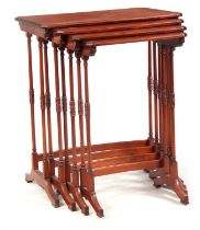 A NEST OF FOUR EARLY 20TH CENTURY SATINWOOD AND MAHOGANY INLAID OCCASIONAL TABLES