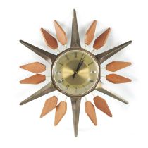 A STYLISH 1960’S BRASS AND TEAK STARBURST WALL CLOCK