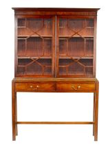 A GEORGE III AND LATER GLAZED BOOKCASE ON STAND