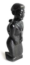 A 20TH CENTURY AFRICAN CARVED EBONY FIGURE