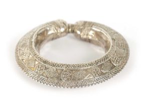 A 19TH CENTURY SILVER AFRICAN TRIBAL BANGLE