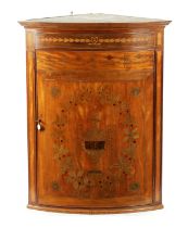 A 19TH CENTURY MARQUETRY INLAID SATINWOOD ADAM STYLE BOW-FRONT CORNER CUPBOARD