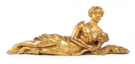 AN 18TH CENTURY CARVED GILT WOOD FIGURE OF A RECLINING FEMALE
