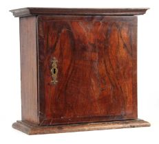 AN 18TH CENTURY OAK AND CROSSBANDED FIGURED WALNUT SPICE CABINET