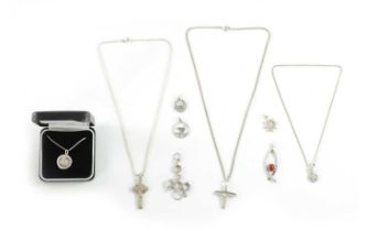 A COLLECTION OF OF SILVER NECKLACES AND PENDANTS