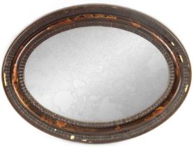 A 19TH CENTURY CHINOISERIE DECORATED OVAL LACQUERED HANGING MIRROR