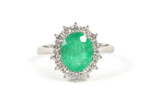 AN 18CT WHITE GOLD DIAMOND AND EMERALD LADIES RING