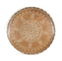 A LARGE 19TH CENTURY INDIAN EMBOSSED COPPER TRAY